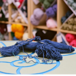 Knitting in progress laying on a table in the shape of an ammonite.