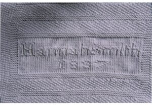Makers detail (Hannah H Smith and 1887) from knitted bedspread