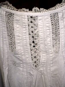 Detail of camisole showing crochet panels and neckline