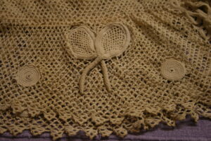 Tennis racquet detail on a crochet top