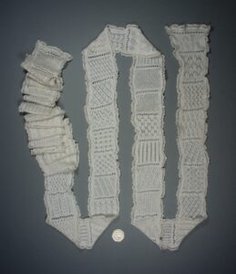 Knitted sampler from 1891 showing many openwork stitch patterns