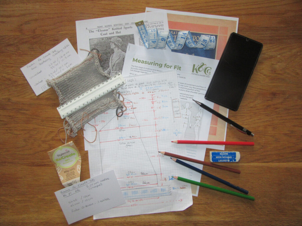 Pattern, swatch, pencils, measurement template, and other items used in adapting a pattern