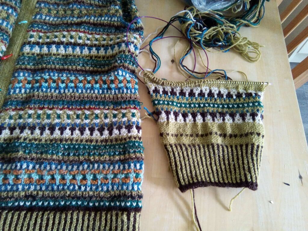 Two sleeves (one only partly knit in the Bohus stule