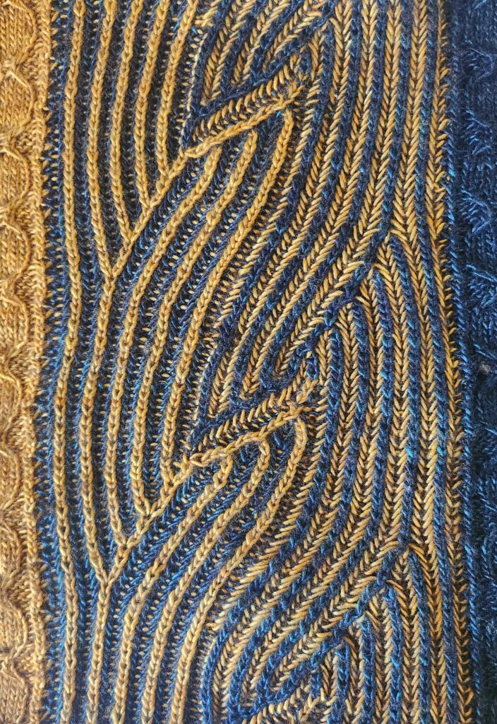 Photograph of syncopated brioche in blue and gold.
