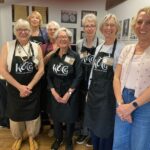 Patron Jane Crowfoot (front right) and members of our Collections Team