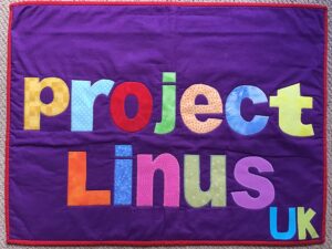 Quilt with the words "Project Linus UK"